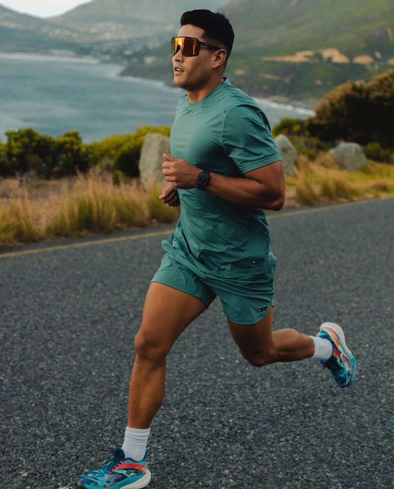 Runner training on a coastal road